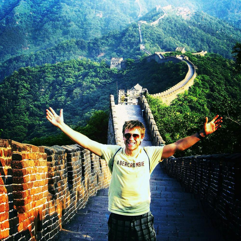 Dustin Pfundheller, a 30-year-old UF doctoral graduate, poses in front of the Great Wall of China during his travels. Pfundheller believes he will soon be the youngest person to travel to 230 countries.