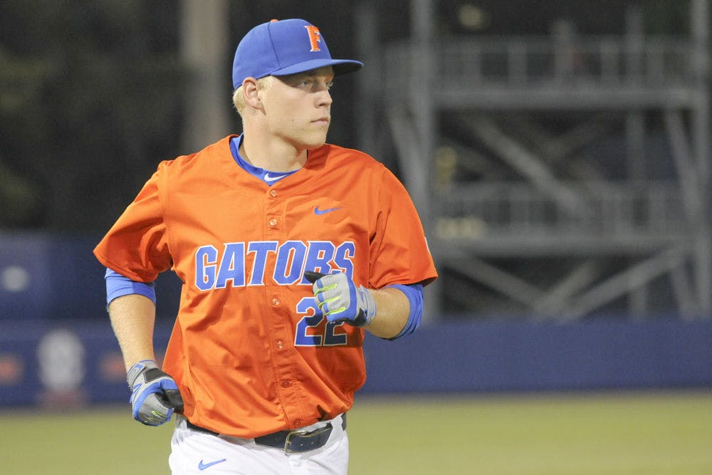 <p>JJ Schwarz jogs off the field during Florida's 5-4 win over UNF on March 9, 2016, at McKethan Stadium.</p>