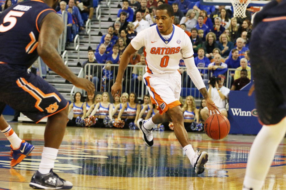 <p>Kasey Hill drives into the paint during Florida's win against Auburn on Thursday in the O'Connell Center.</p>