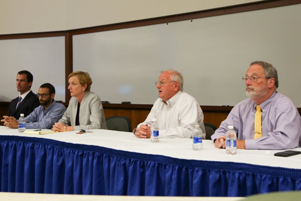 <p>From left: Paul O’Quinn, Adam Smith, Lyrissa Lidsky, Martin McMahon and Steven Willis have an open discussion with members of UF’s tax program regarding a controversial memo sent by UF law professor Robert J. Rhee.</p>