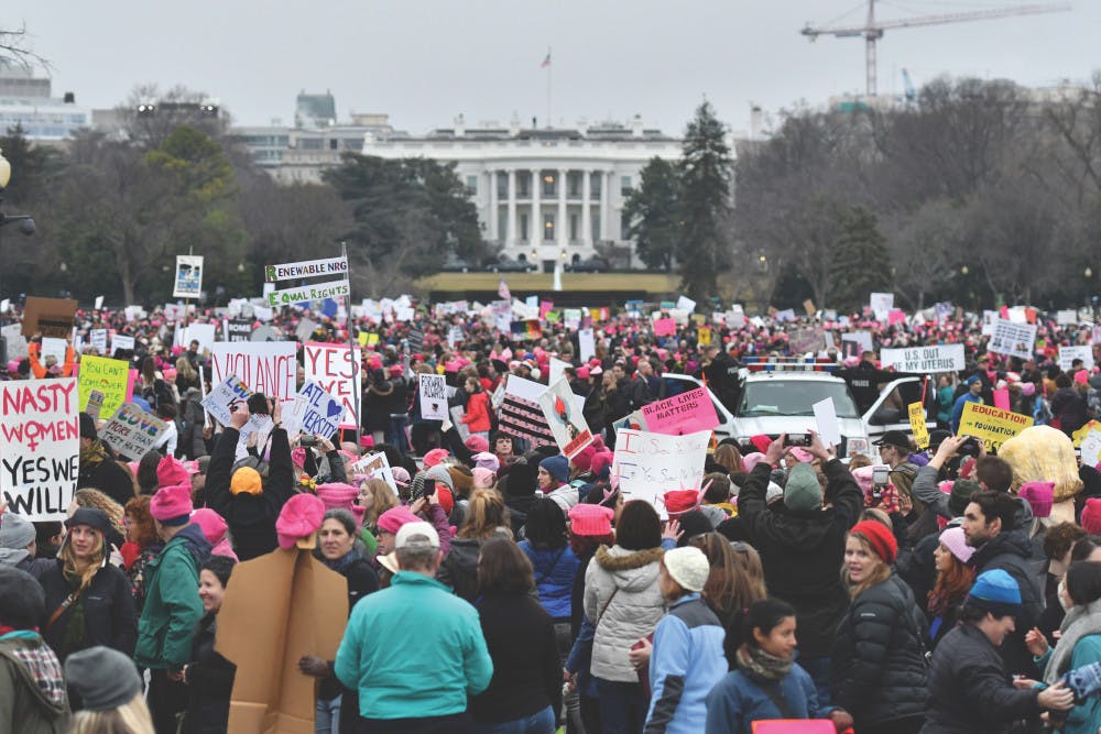 Thousands gather on the Ellipse near the back lawn of the White House at the conclusion of the Women’s March on Washington. Many of the marchers placed their posters along a few small fences to create “walls” near the White House.