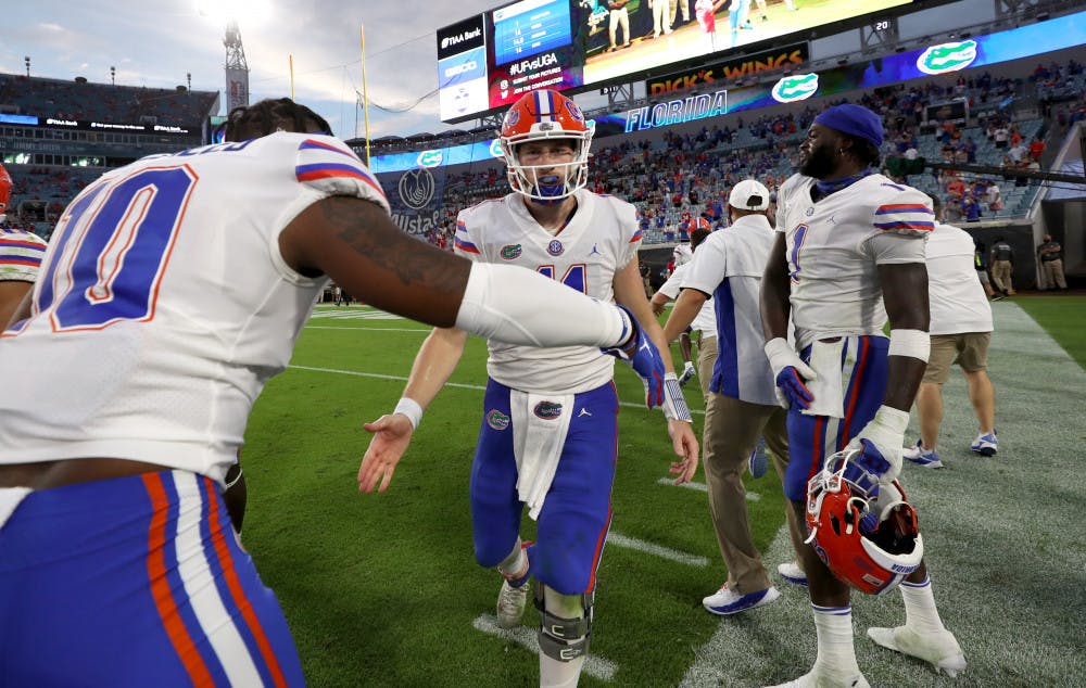 <p dir="ltr">Gators quarterback Kyle Trask daps up linebacker Andrew Chatfield Jr. at TIAA Bank Field in Jacksonville, Florida, on Nov. 7. Florida beat Georgia for the first time since 2016 on Saturday 44-28.</p>