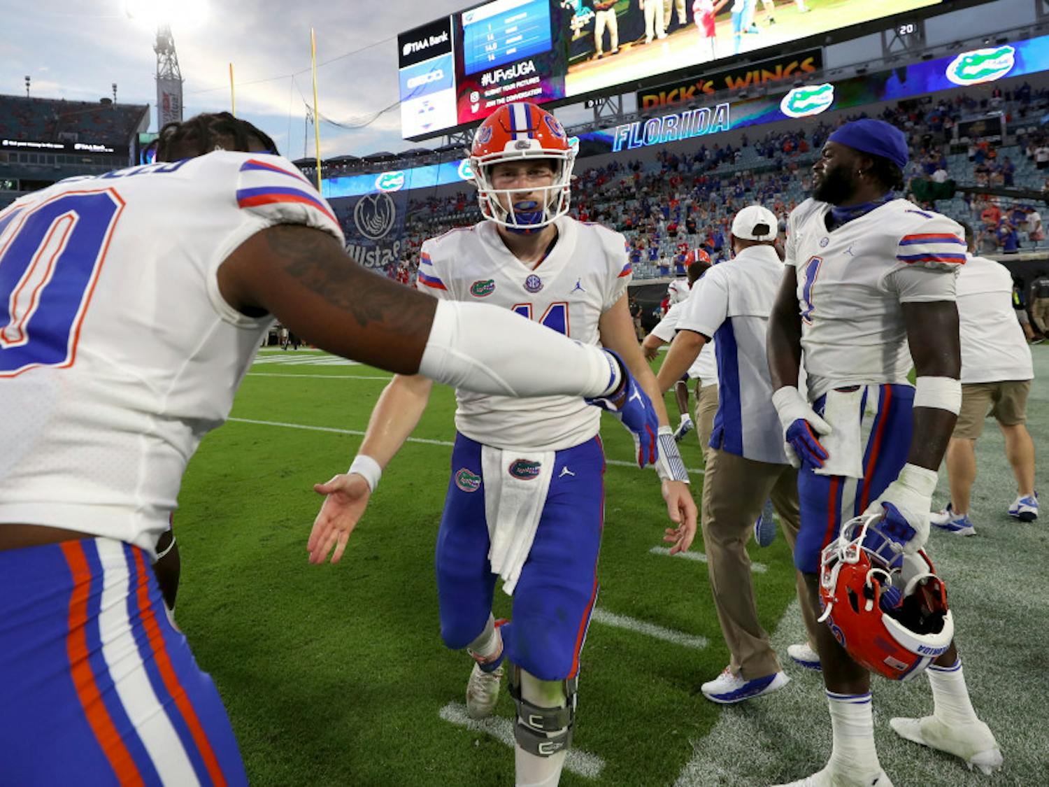 Gators quarterback Kyle Trask daps up linebacker Andrew Chatfield Jr. at TIAA Bank Field in Jacksonville, Florida, on Nov. 7. Florida beat Georgia for the first time since 2016 on Saturday 44-28.