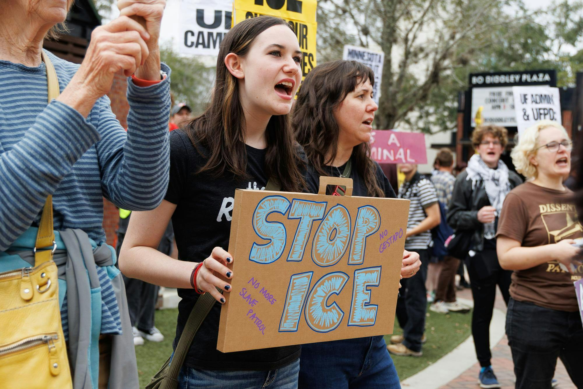 Marti holds a sign at an ICE protest at the Alachua County Clerk of Court, Sunday, Jan. 25, 2026.