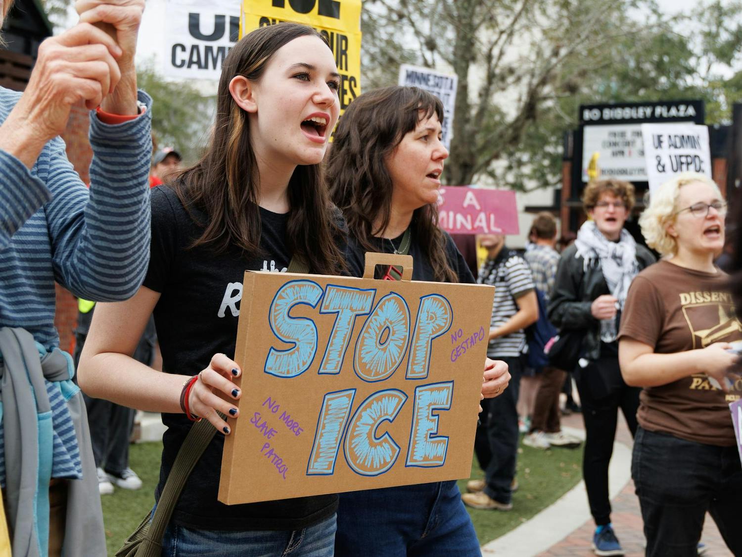 Marti holds a sign at an ICE protest at the Alachua County Clerk of Court, Sunday, Jan. 25, 2026.
