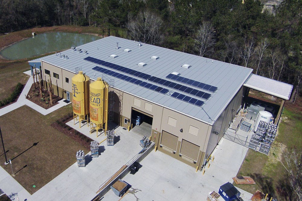 <p><span id="docs-internal-guid-a3d2ef17-b4e4-b4c4-0dc7-394e7e5c6583"><span>Taken from an aerial, remote-control drone, this photo shows Swamp Head Brewery’s solar panel installation mounted on the roof of the building.</span></span></p>