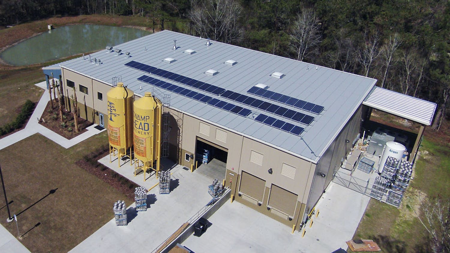 Taken from an aerial, remote-control drone, this photo shows Swamp Head Brewery’s solar panel installation mounted on the roof of the building.
