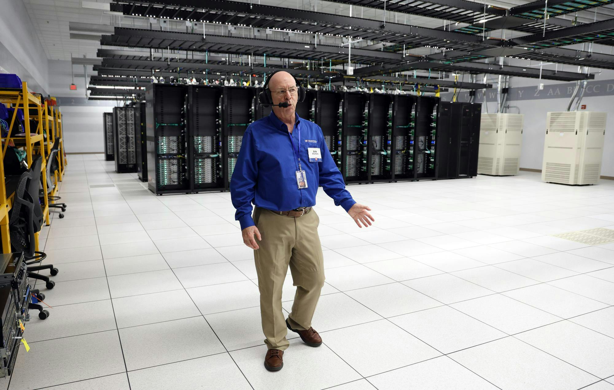 Erik Deumens, director of research computing in UF Information Technology, guides members of the media through “the bunker,” the housing facility for the computers that make up the fourth generation of HiPerGator, the most powerful university-owned supercomputer in the U.S., at UF East Campus on Tuesday, Oct. 14, 2025.