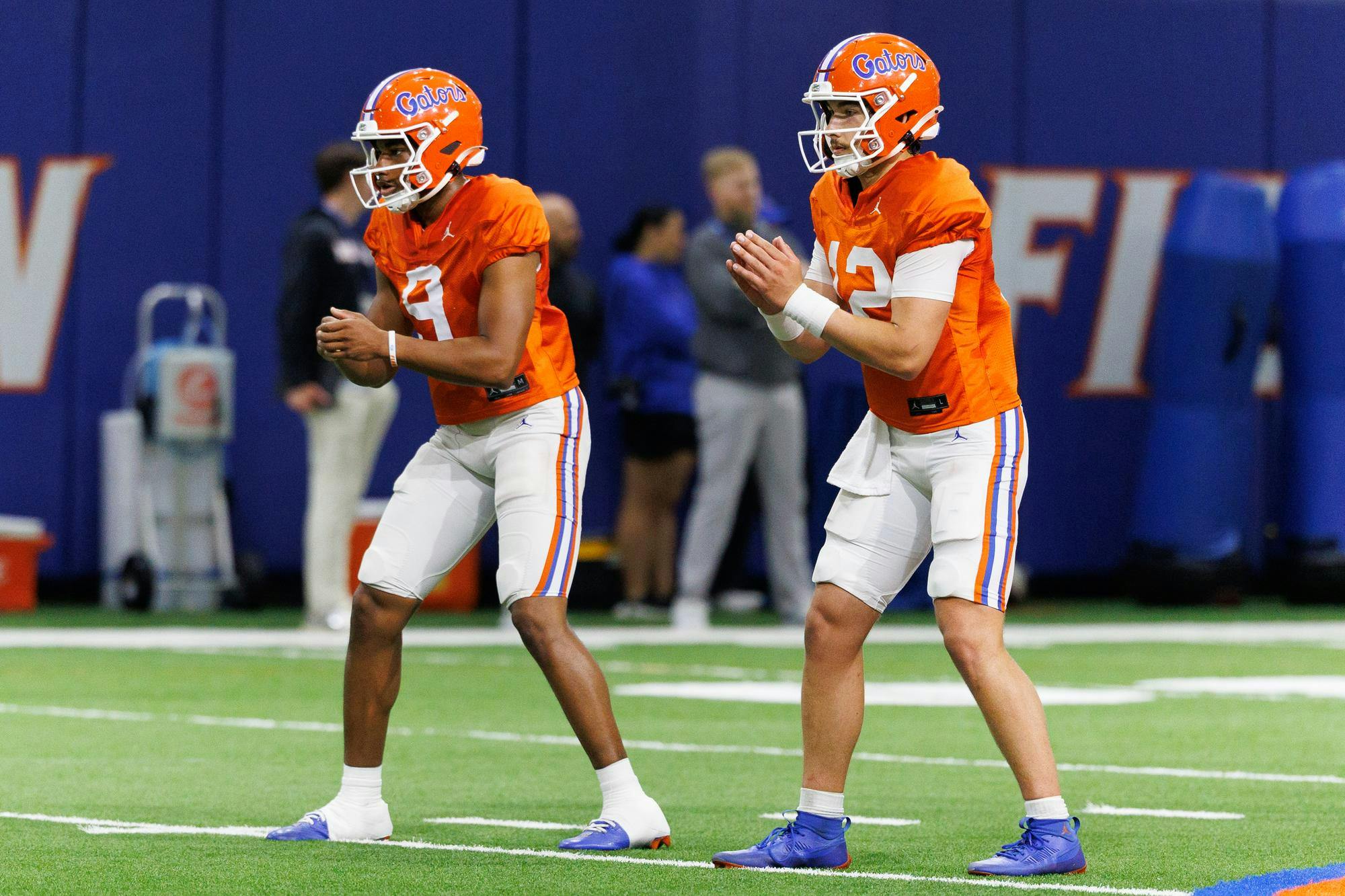 Florida quarterback Tramell Jones Jr. (9) and Florida quarterback Aaron Philo (12) snap the ball during spring practice at the Heavener Football Training Center in Gainesville, Fla., on Tuesday, April 7, 2026.