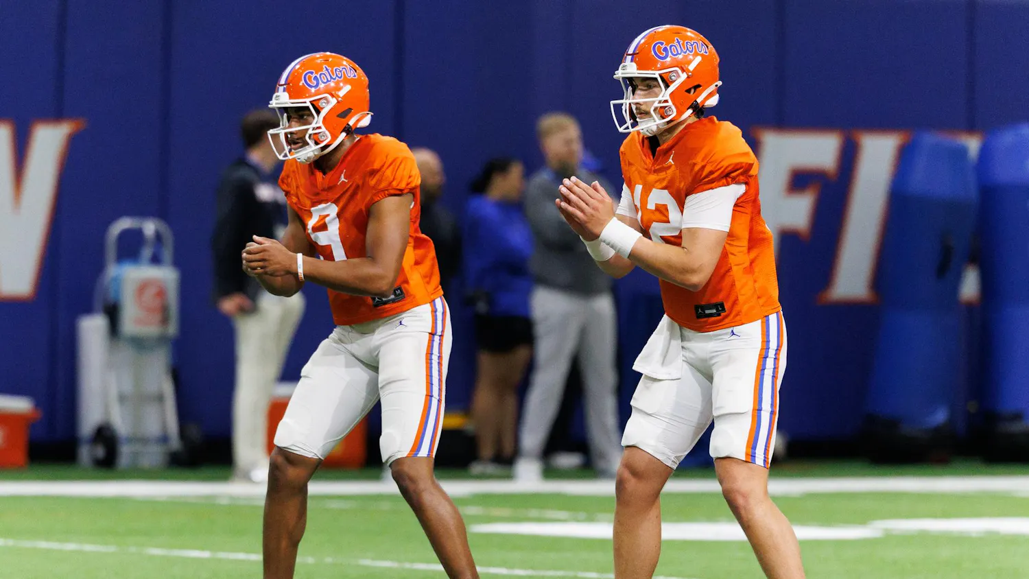 Florida quarterback Tramell Jones Jr. (9) and Florida quarterback Aaron Philo (12) snap the ball during spring practice at the Heavener Football Training Center in Gainesville, Fla., Tuesday, April 7, 2026.