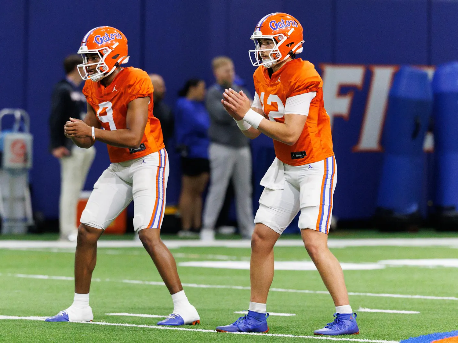Florida quarterback Tramell Jones Jr. (9) and Florida quarterback Aaron Philo (12) snap the ball during spring practice at the Heavener Football Training Center in Gainesville, Fla., on Tuesday, April 7, 2026.