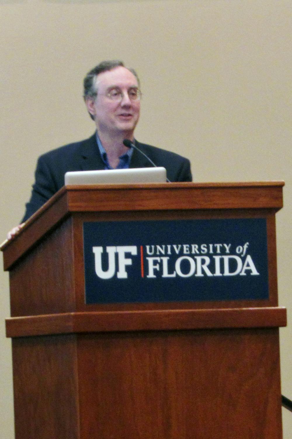 <p>Dr. Juan Cole, a professor of history from the University of Michigan, speaks to an audience on youth involvement in Middle Eastern politics in the Reitz Union Grand Ballroom on Thursday night.</p>
