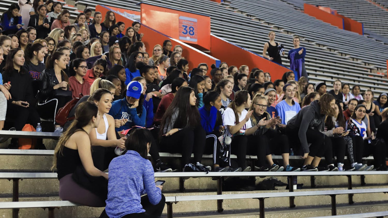 Students waited Friday evening at the Ben Hill Griffin Stadium for PINK campus representatives to announce raffle winners. One hundred sports bras were given away.