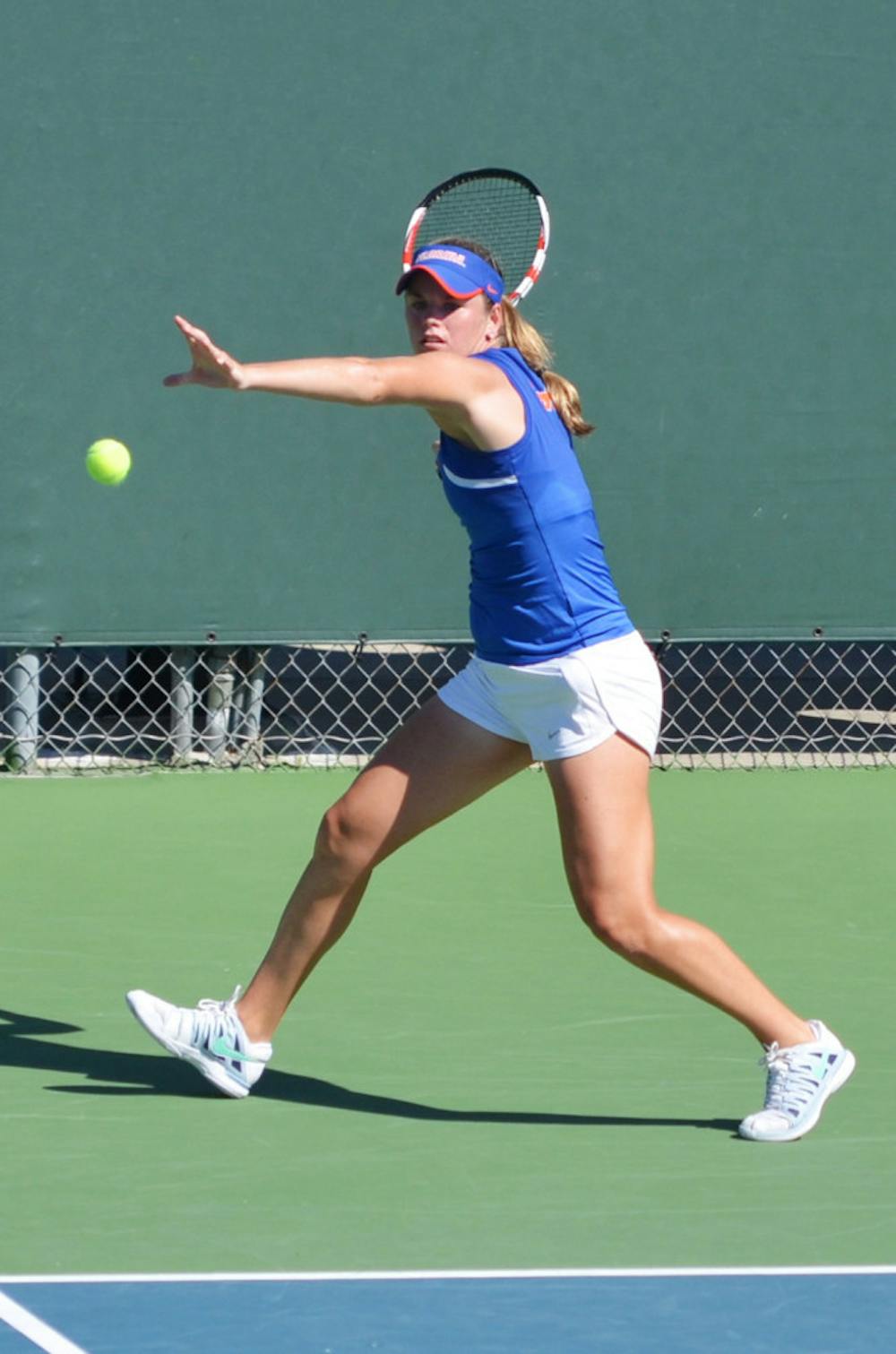 <p>Belinda Woolcock attempts to hit the ball at the Bedford Cup at the Ring Tennis Complex on Oct. 13, 2013.</p>