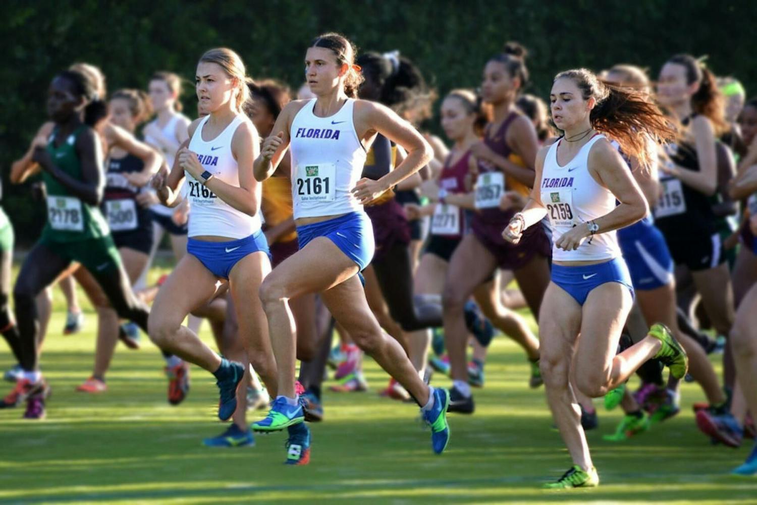 Three members of the Florida women&#x27;s cross country competing.