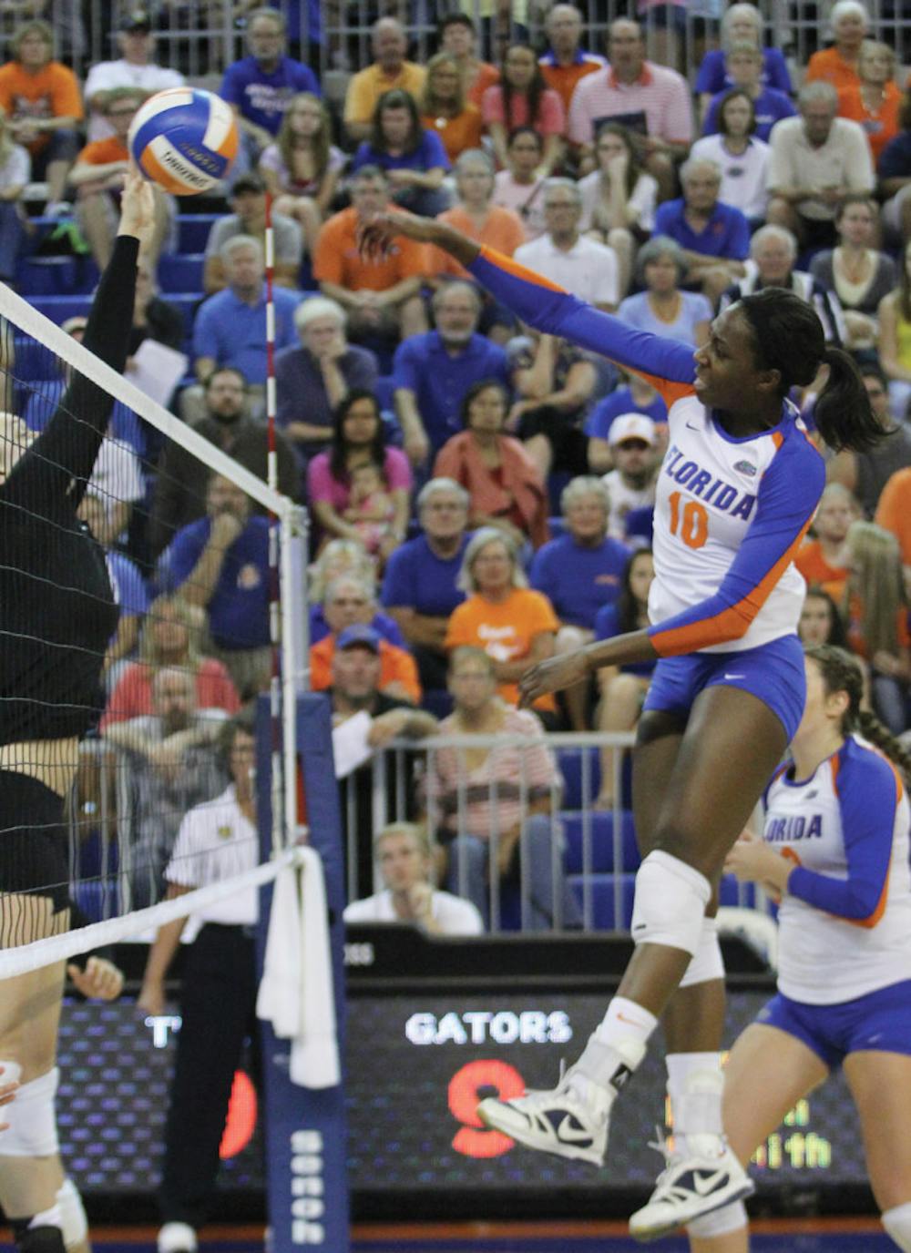<p>Junior middle-blocker Chloe Mann attacks the Missouri defense. Florida won the match 3-0 at the Stephen C. O'Connell Center on Friday night.</p>
