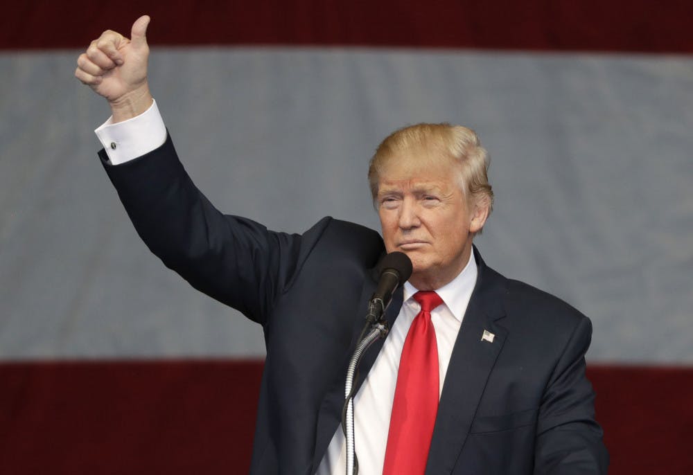 Republican presidential candidate Donald Trump gestures during a campaign rally, Wednesday, Oct. 5, 2016, in Las Vegas.