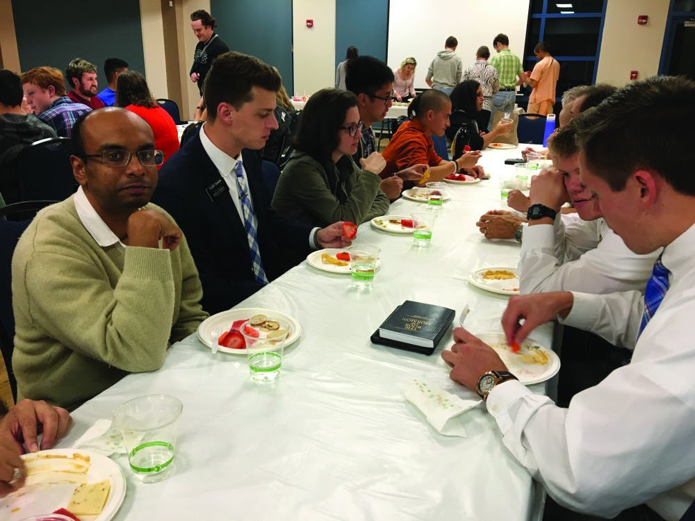 A group of people from various religious backgrounds gather at UF Hillel for the UF Campus Multi-Faith Cooperative’s “Faith in Diversity: Progressive Dinner.”