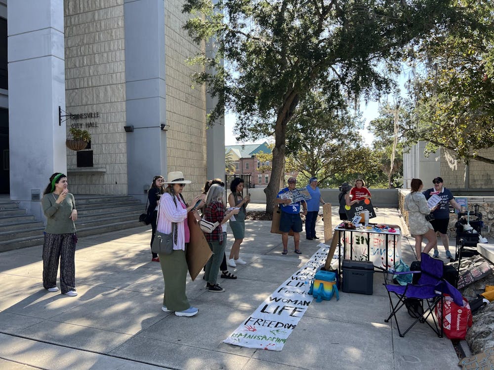 <p>Women's rights protesters organize in front of at City Hall on Monday, June 24, 2024.</p>