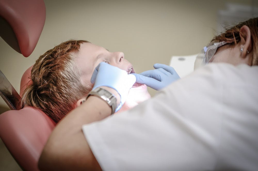 A dentist working on a patient's teeth. 