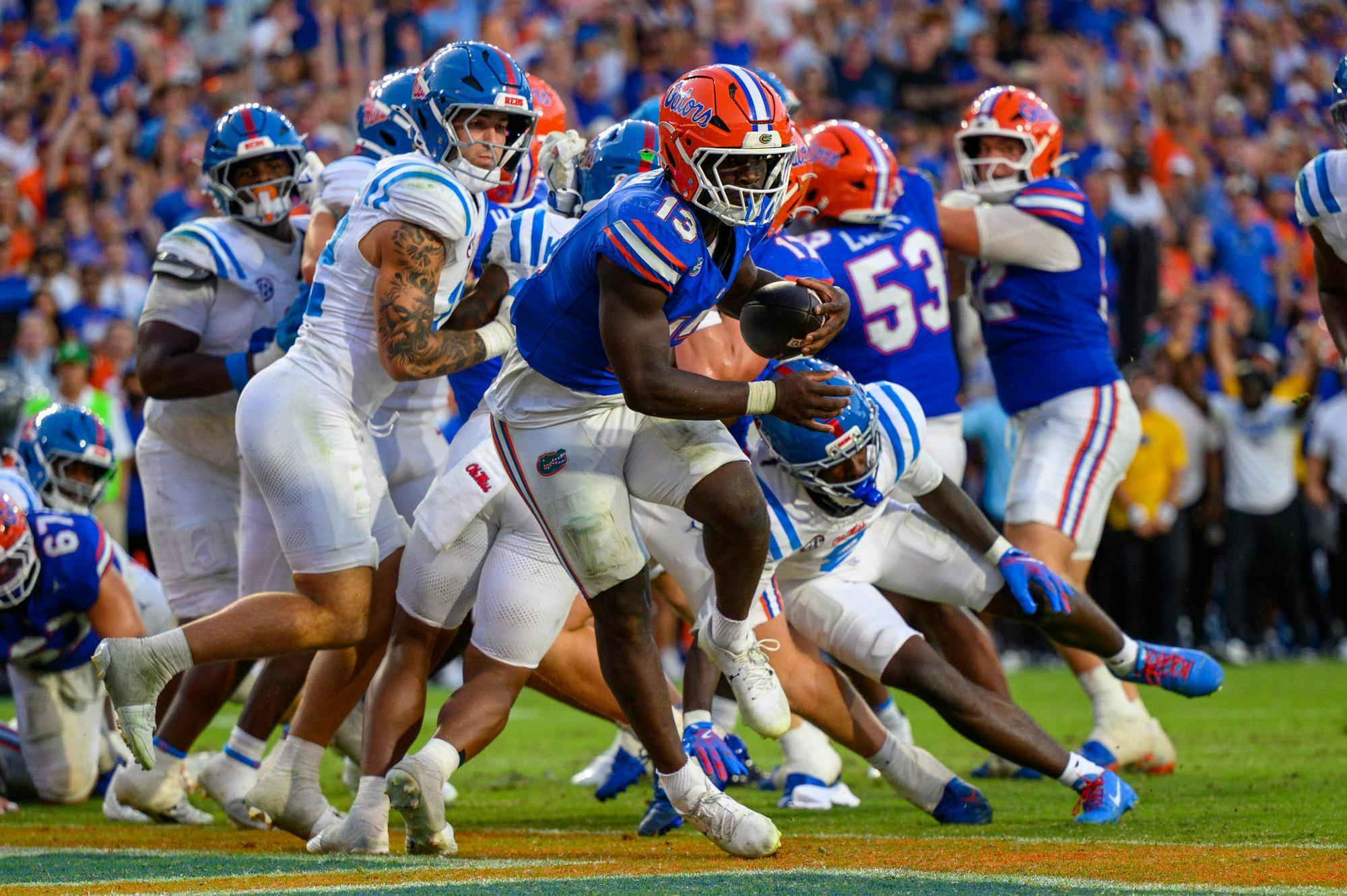 Florida running back Jadan Baugh (13) jumps into the end zone during the second half of an NCAA college football game against Ole Miss, Saturday, Sept. 26, 2026, in Gainesville, Fla.