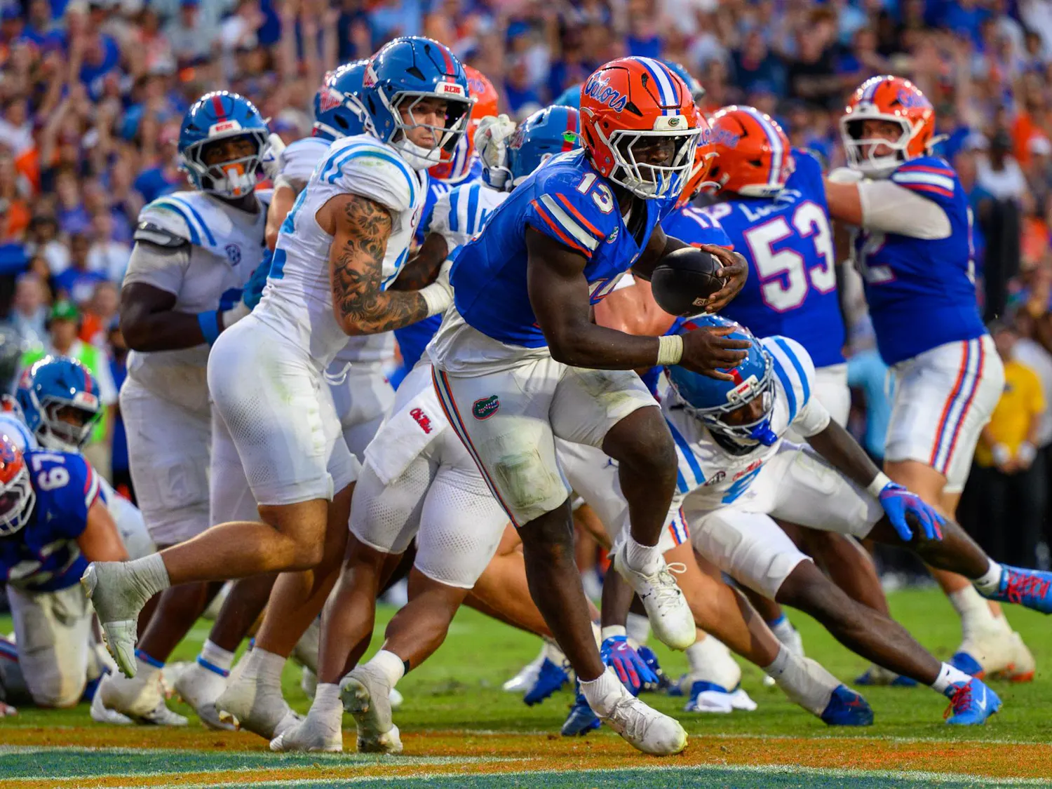 Florida running back Jadan Baugh (13) jumps into the end zone during the second half of an NCAA college football game against Ole Miss, Saturday, Sept. 26, 2026, in Gainesville, Fla.