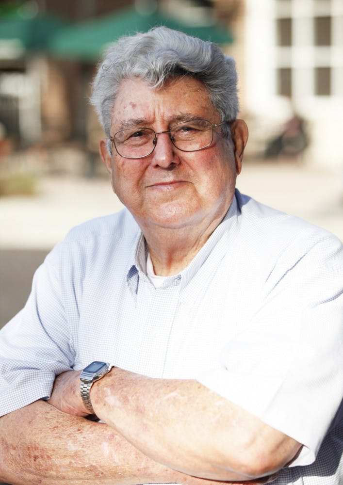 W.E. “Mac” McEachern, 81, stands on the corner of Southeast Second Place and Southeast First Street on Feb. 12. McEachern is running for District 4 city commissioner.
