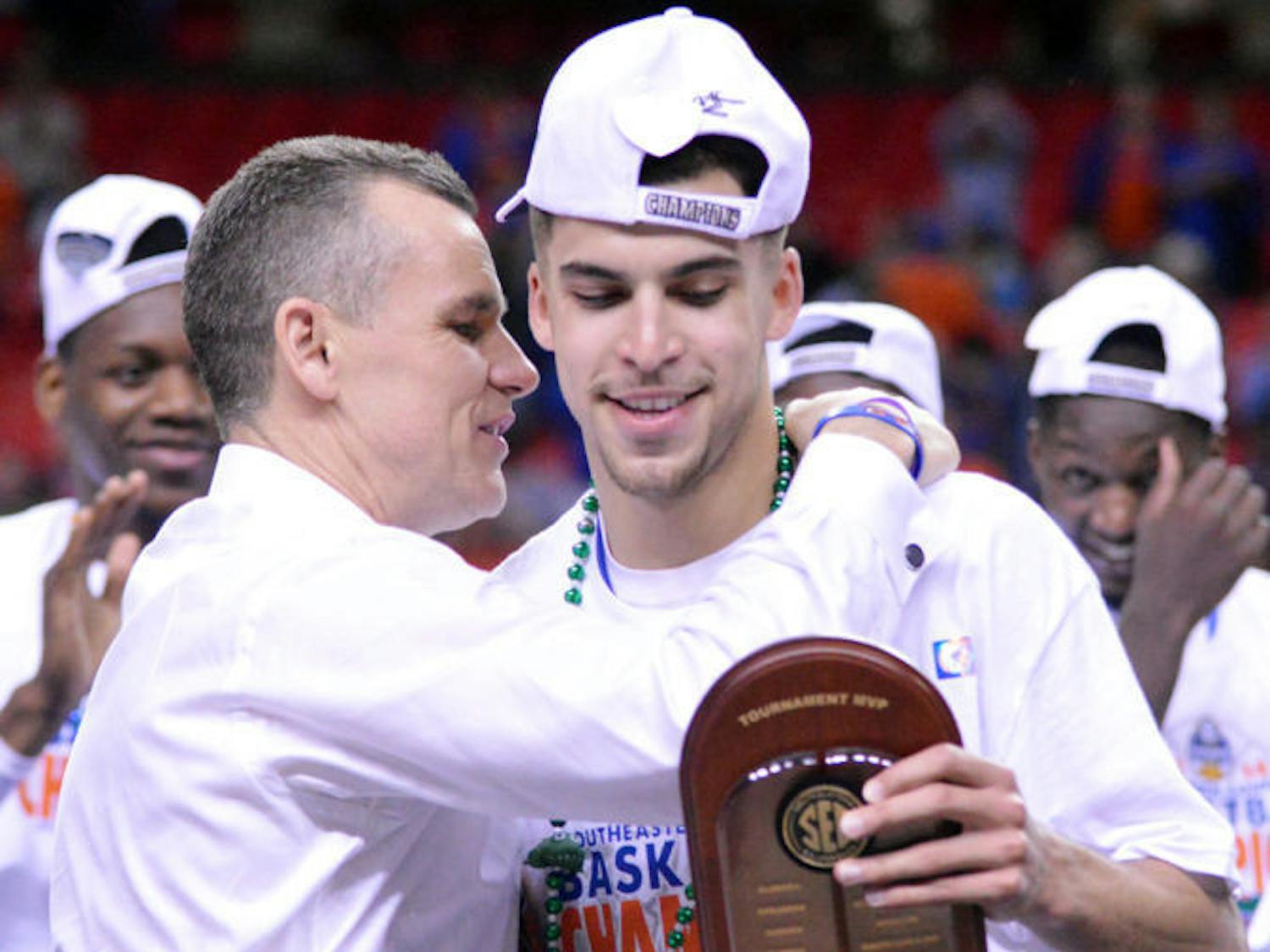 Coach Billy Donovan embraces Scottie Wilbekin after Wilbekin received his Southeastern Conference Tournament MVP award on Sunday in the Georgia Dome in Atlanta.