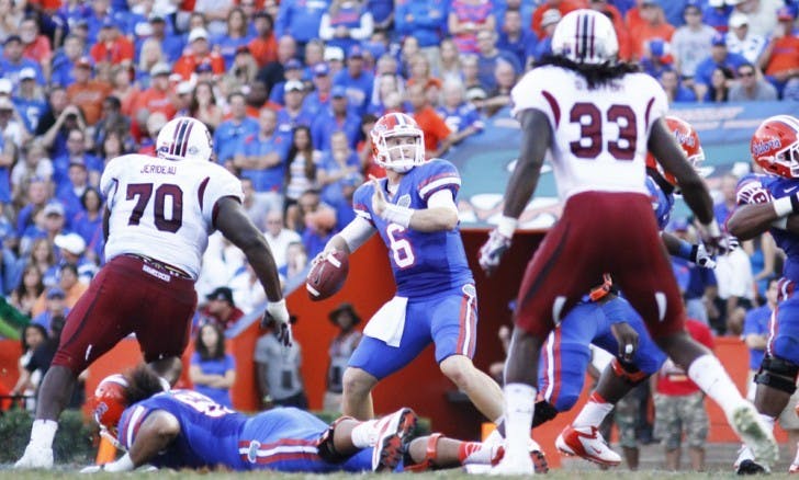 Jeff Driskel (6) attempts a pass against South Carolina in UF’s 44-11 win on Saturday in The Swamp. Driskel failed to reach 100 yards passing for the third game in a row.
