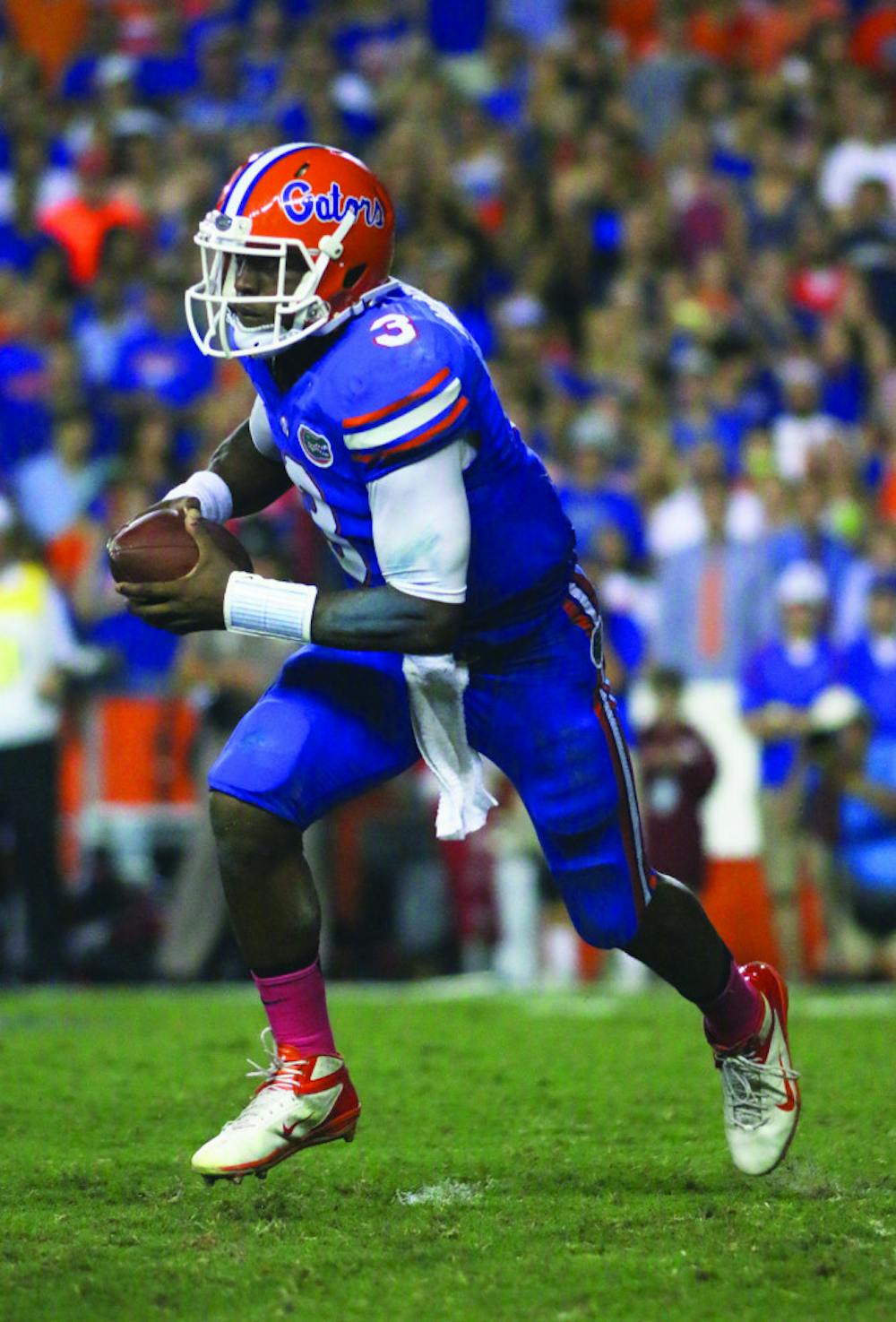 <p>Tyler Murphy runs the ball during Florida’s 30-10 victory against Arkansas on Saturday in Ben Hill Griffin Stadium. The Gators are 4-1 this season.</p>