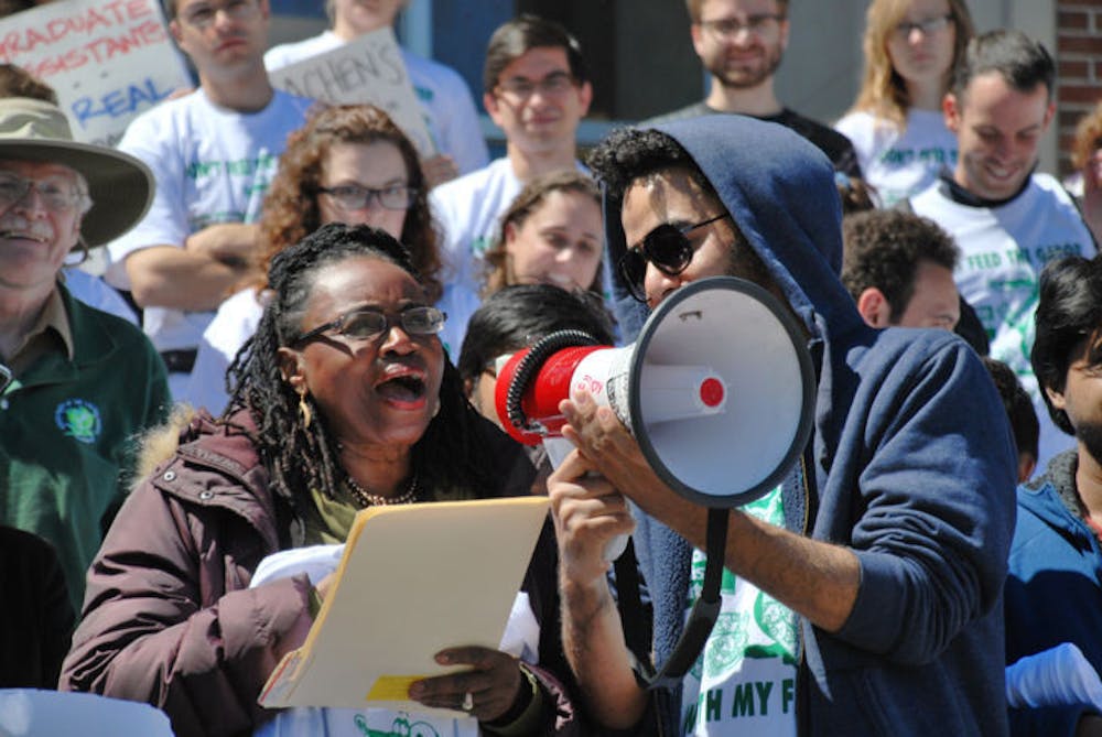 <p class="p1">Gwendolyn Zoharah Simmons, a UF assistant professor and activist, supports Graduate Assistants United at the rally against tuition fees on Thursday at Tigert Hall.</p>