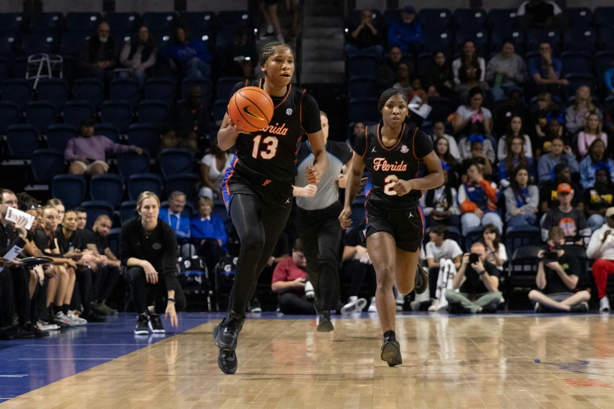 Laila Reynolds dribbles the ball up the court in the Gators women’s basketball game against the Arkansas Razorbacks on Thursday, February 8. Photo by Ryan Friedenberg