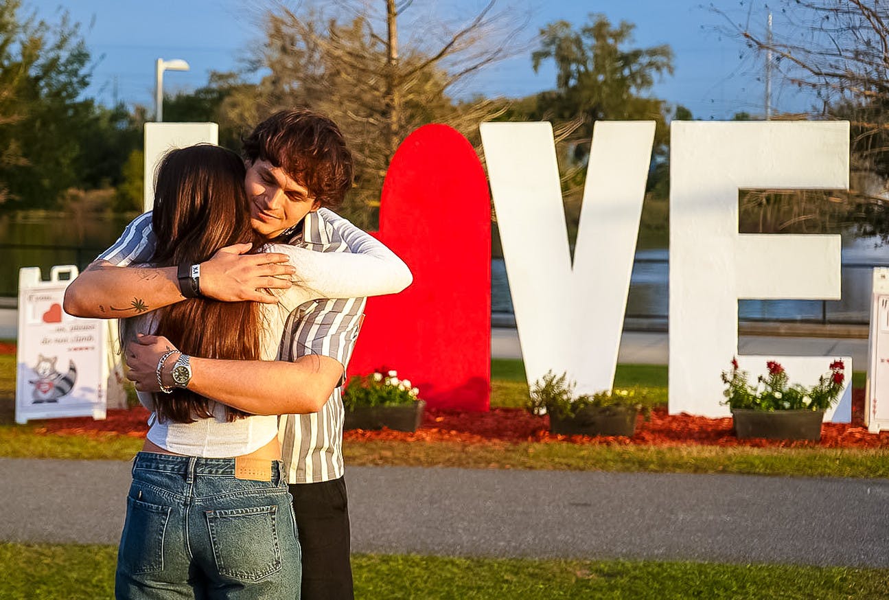 Jonah Marais hugs a fan after his performance at Depot Park on Feb. 23, 2025.