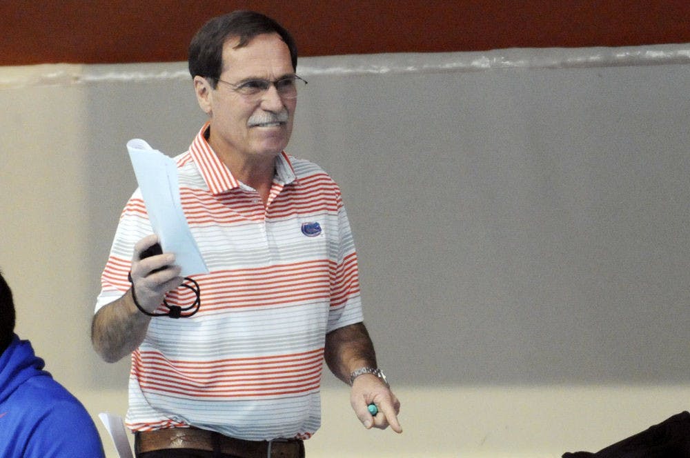 UF coach Gregg Troy encourages his swimmers during Florida’s meet against Auburn on Jan. 23, 2016, in the O’Connell Center.