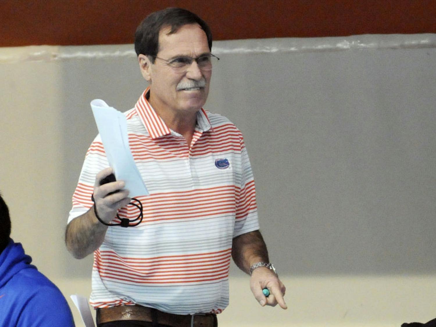 UF coach Gregg Troy encourages his swimmers during Florida’s meet against Auburn on Jan. 23, 2016, in the O’Connell Center.