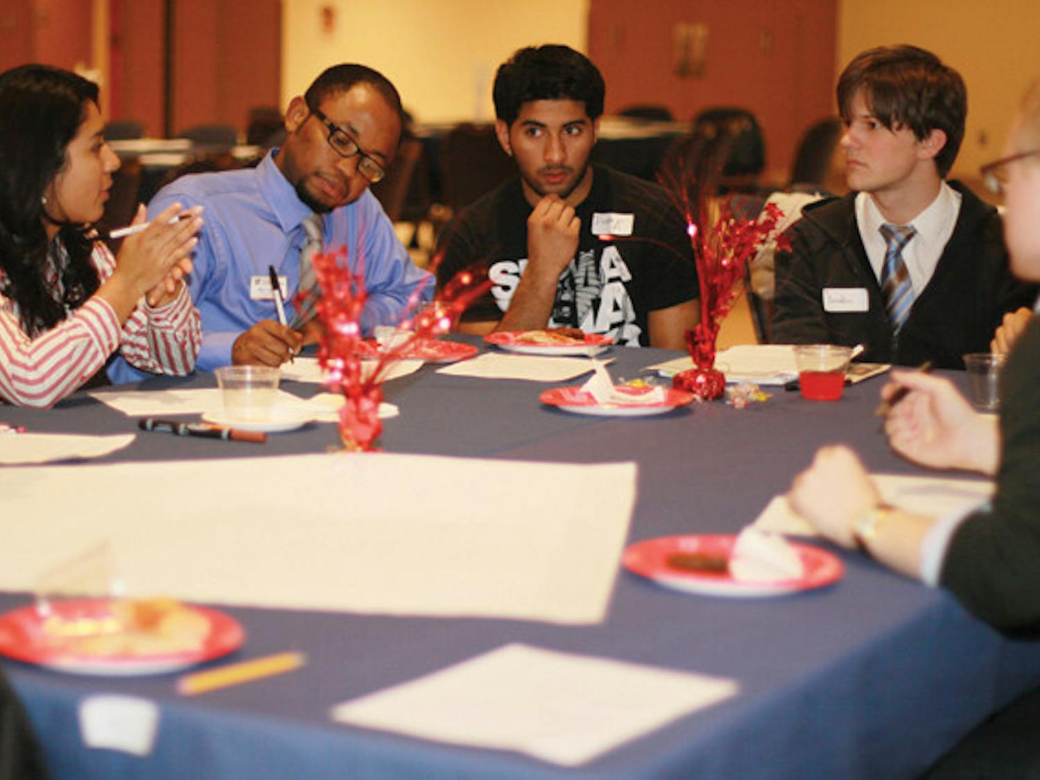 Students discuss how the university can use its resources to reach out to first-generation or low-income students at the Educational Access Summit in the Reitz Union Rion Ballroom on Thursday.