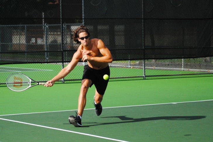 Aaron Crews, a 19-year-old UF health sciences sophomore plays tennis at the Southwest Recreational Facilities on Monday afternoon.&nbsp;
&nbsp;