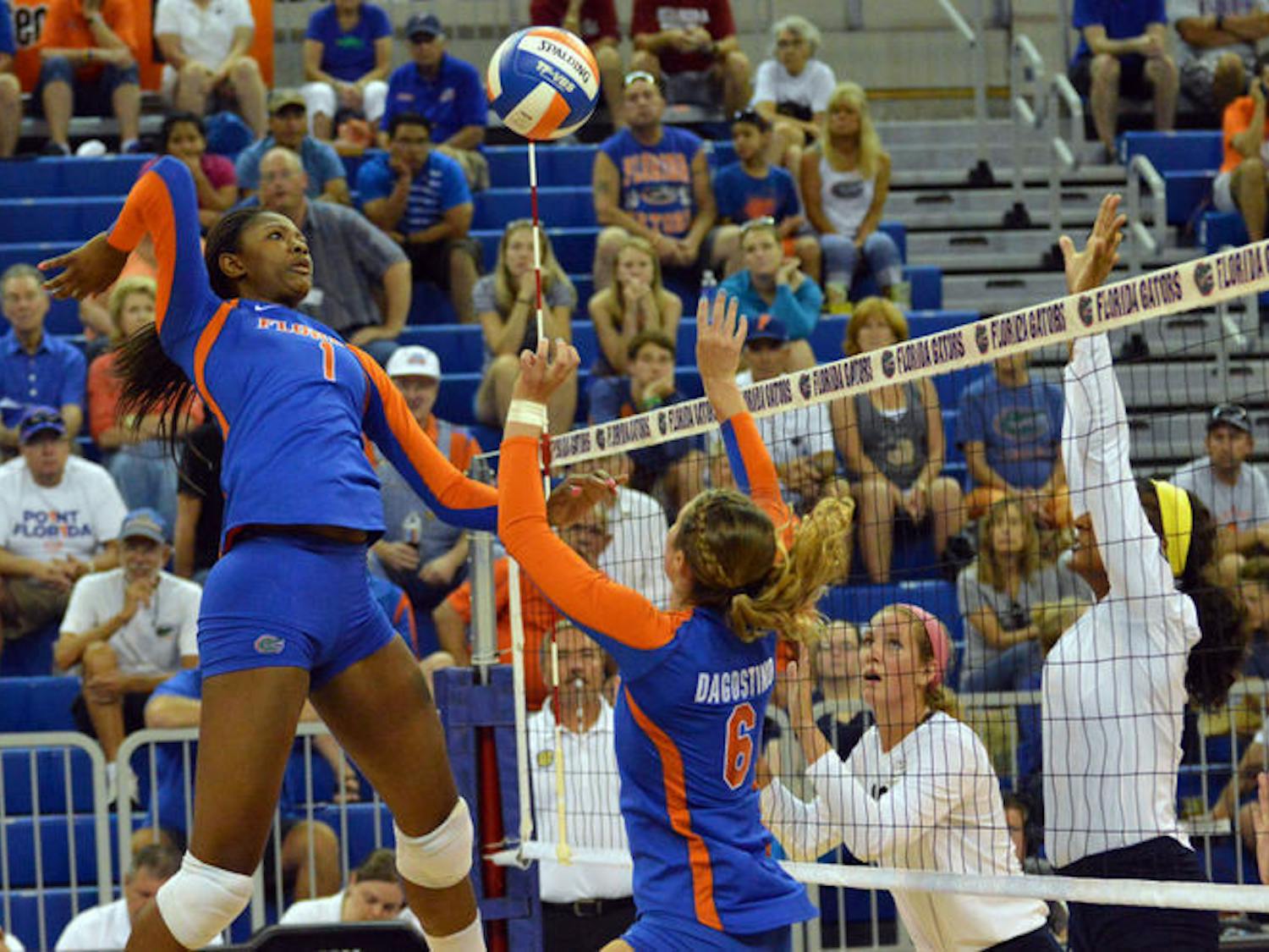 Senior middle blocker Rhamat Alhassan swings for a kill during Florida's 3-0 win against Georgia Southern on Aug. 29 in the O'Connell Center.
