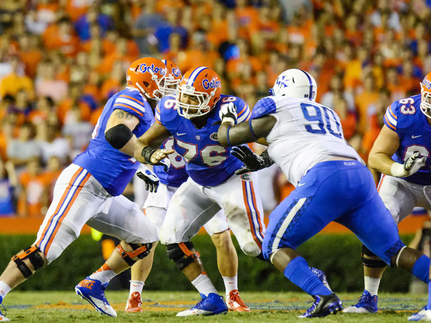 Florida center Max Garcia (76) blocks Kentucky defensive tackle Melvin Lewis (90) during the Gators' 36-30 triple-overtime win against the Wildcats on Saturday at Ben Hill Griffin Stadium.