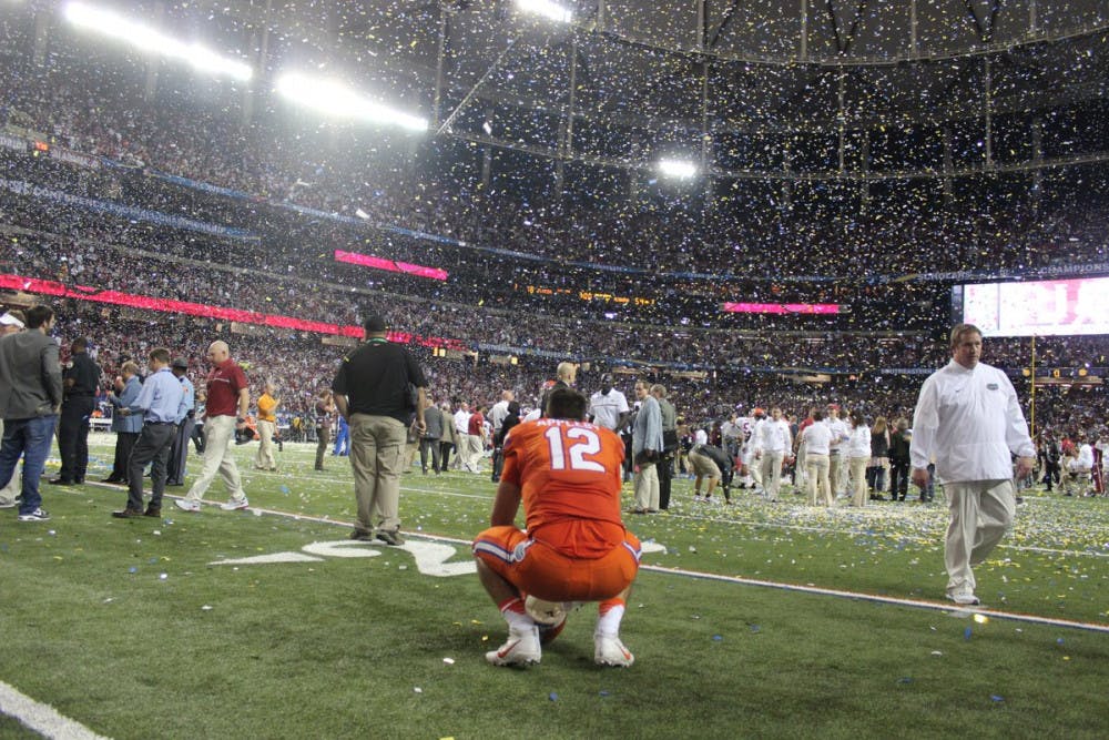 <p>Austin Appleby kneels on the field after Florida's 54-16 loss to Alabama on Dec. 3, 2016, in the SEC Championship Game.</p>