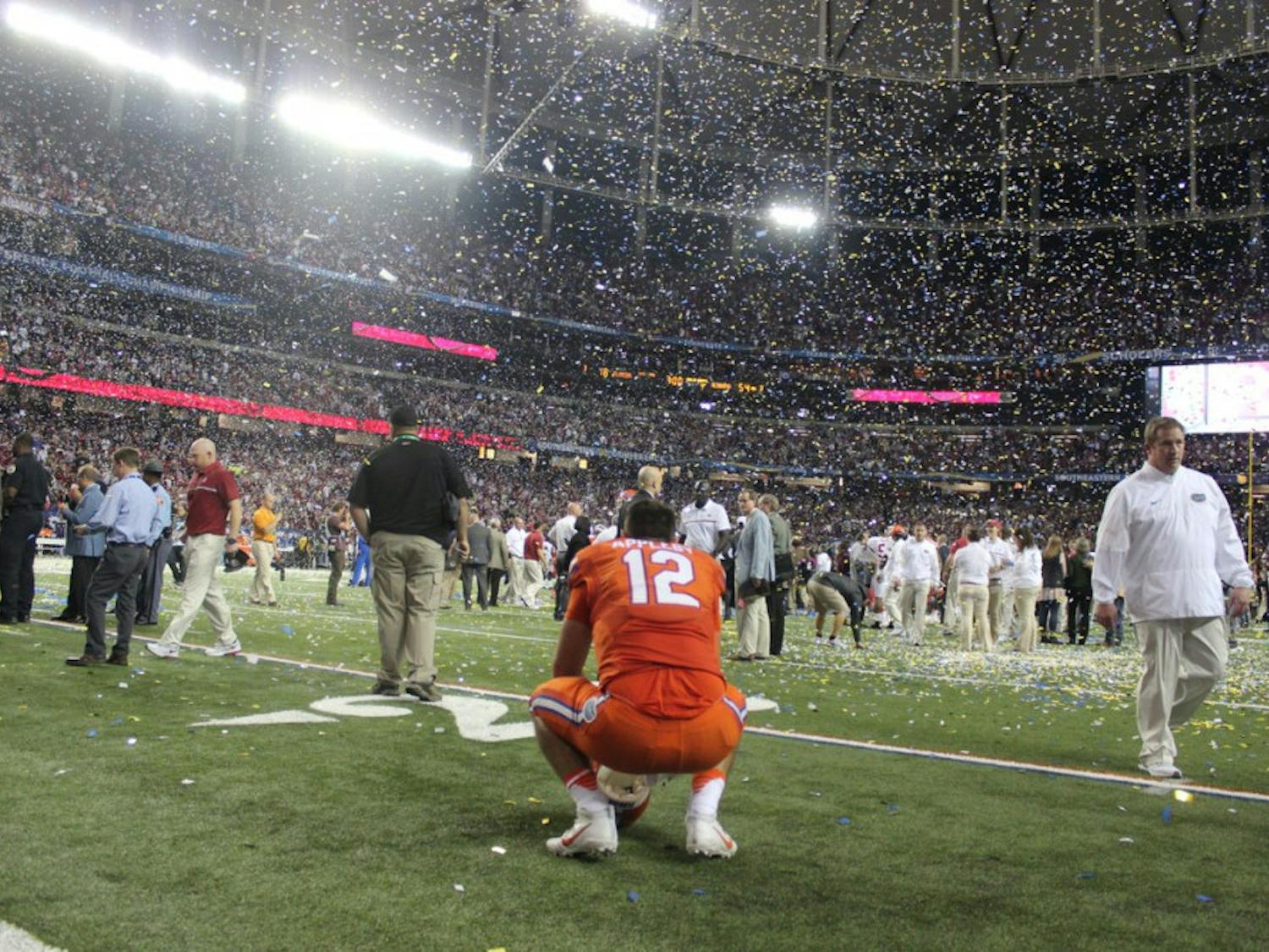 Austin Appleby kneels on the field after Florida's 54-16 loss to Alabama on Dec. 3, 2016, in the SEC Championship Game.