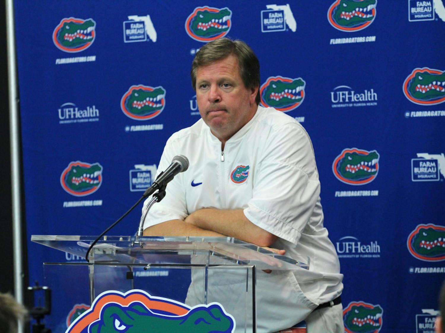UF coach Jim McElwain addresses the media with his arms folded after Florida's 42-7 loss to Georgia on Saturday at EverBank Field in Jacksonville. 