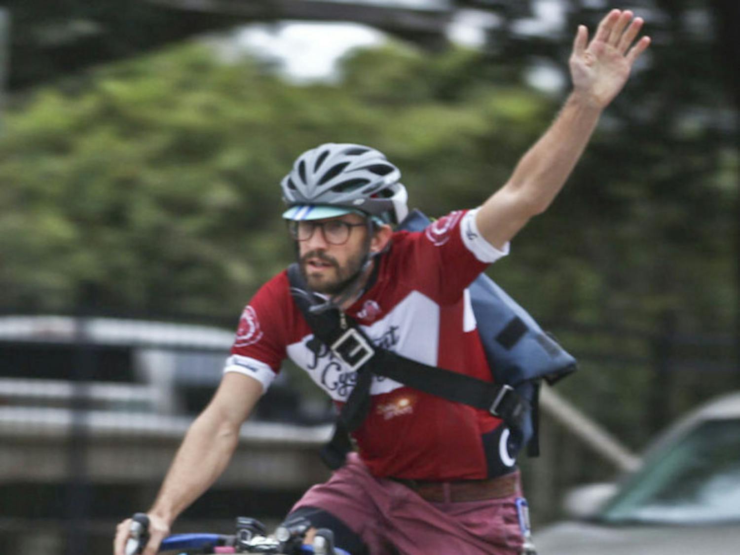 Chris Discenza, a 38-year-old UF coastal engineering graduate student, finishes The Freewheel Project’s third annual Cranksgiving alleycat race with Cauchy, his 7-year-old Pomeranian, on Nov. 22, 2015. “He loves the bike more than anything,” Discenza said. “He was also registered for the race, so I came in 25th and he technically came in 26th.”