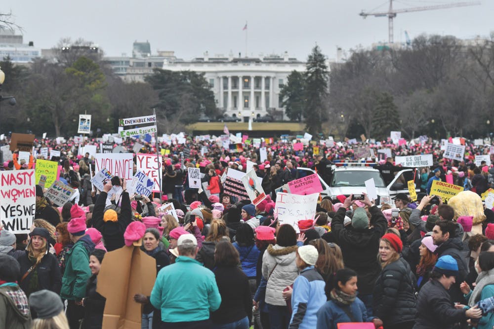<p><span id="docs-internal-guid-a33bee14-c927-5cd1-f4a8-a00f719dc3a4"><span>Thousands gather on the Ellipse near the back lawn of the White House at the conclusion of the Women’s March on Washington. Many of the marchers placed their posters along a few small fences to create “walls” near the White House.</span></span></p>