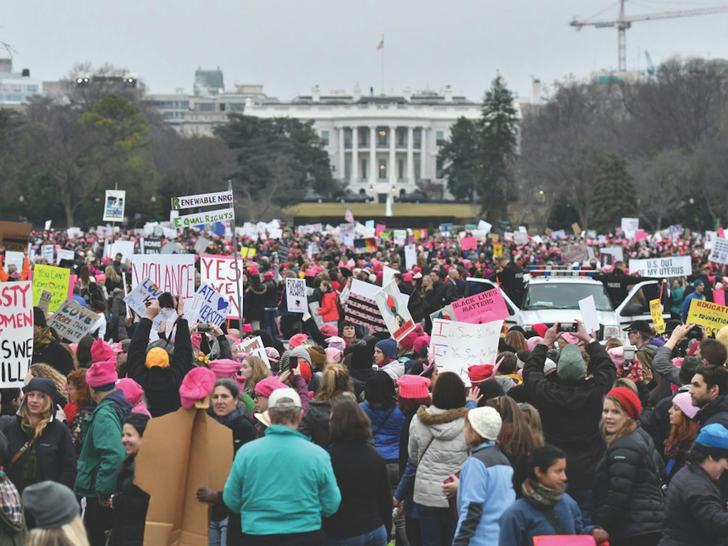 Thousands gather on the Ellipse near the back lawn of the White House at the conclusion of the Women’s March on Washington. Many of the marchers placed their posters along a few small fences to create “walls” near the White House.