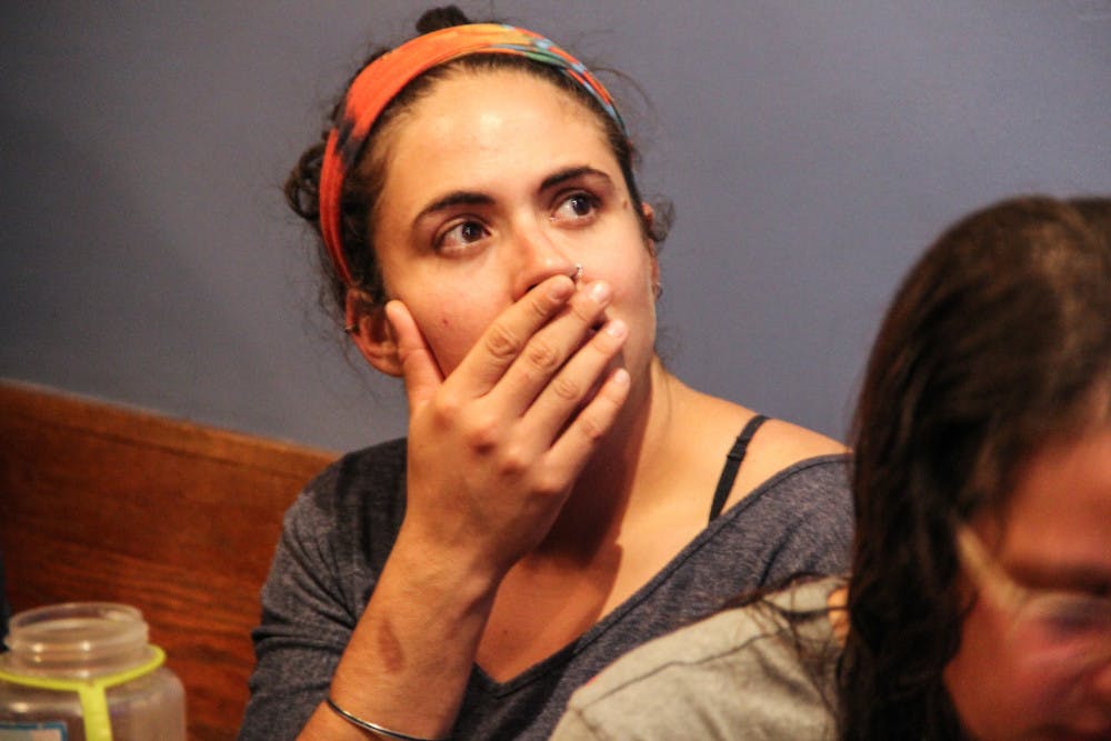 <p dir="ltr">Chelsea MacKenzie, a 26-year-old Clinton supporter, looks up at the TV in shock as the election results become more evident at First Magnitude Brewing Company on Tuesday evening. About 250 people attended the watch party, hosted by the Hillary Clinton campaign.</p><p><span> </span></p>