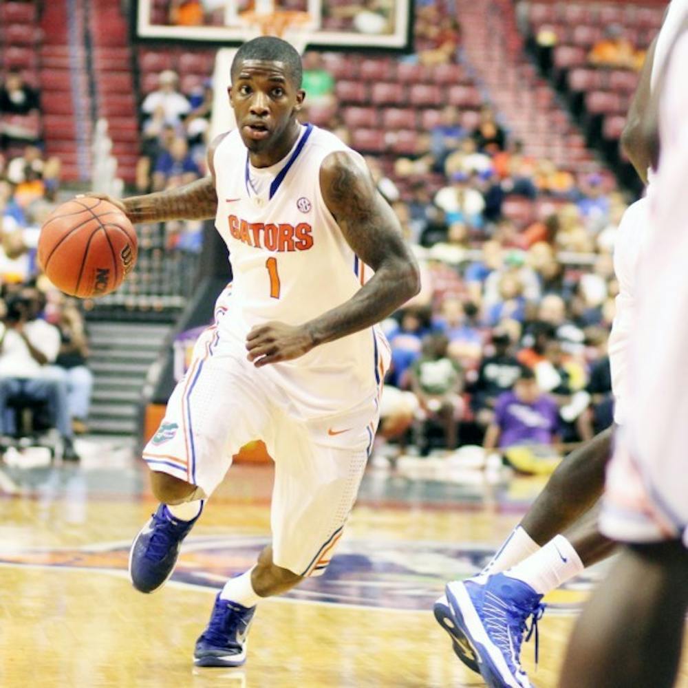 <p>Senior guard Kenny Boynton drives to the basket during Florida's 78-61 victory against Air Force at the Orange Bowl Classic on Saturday in Sunrise, Fla. Boynton shook off recent shooting troubles en route to a 14-point performance.</p>