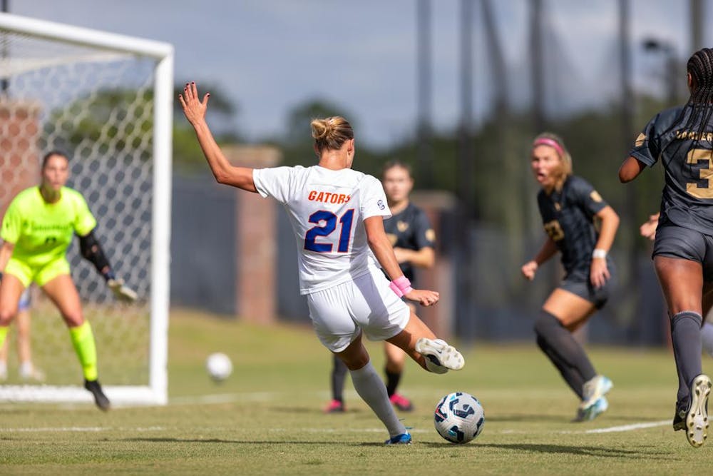 Florida Gators Defender Madison Young (21) takes a shot during the first half at Ronald R. Dizney Stadium on Friday, October 18, 2024.