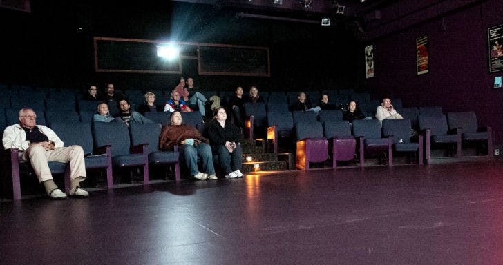 Patrons watch “A Royal Affair” at the Hippodrome State Theatre Cinema on Sunday night. The theater has shown a variety of international and domestic films for 31 years.