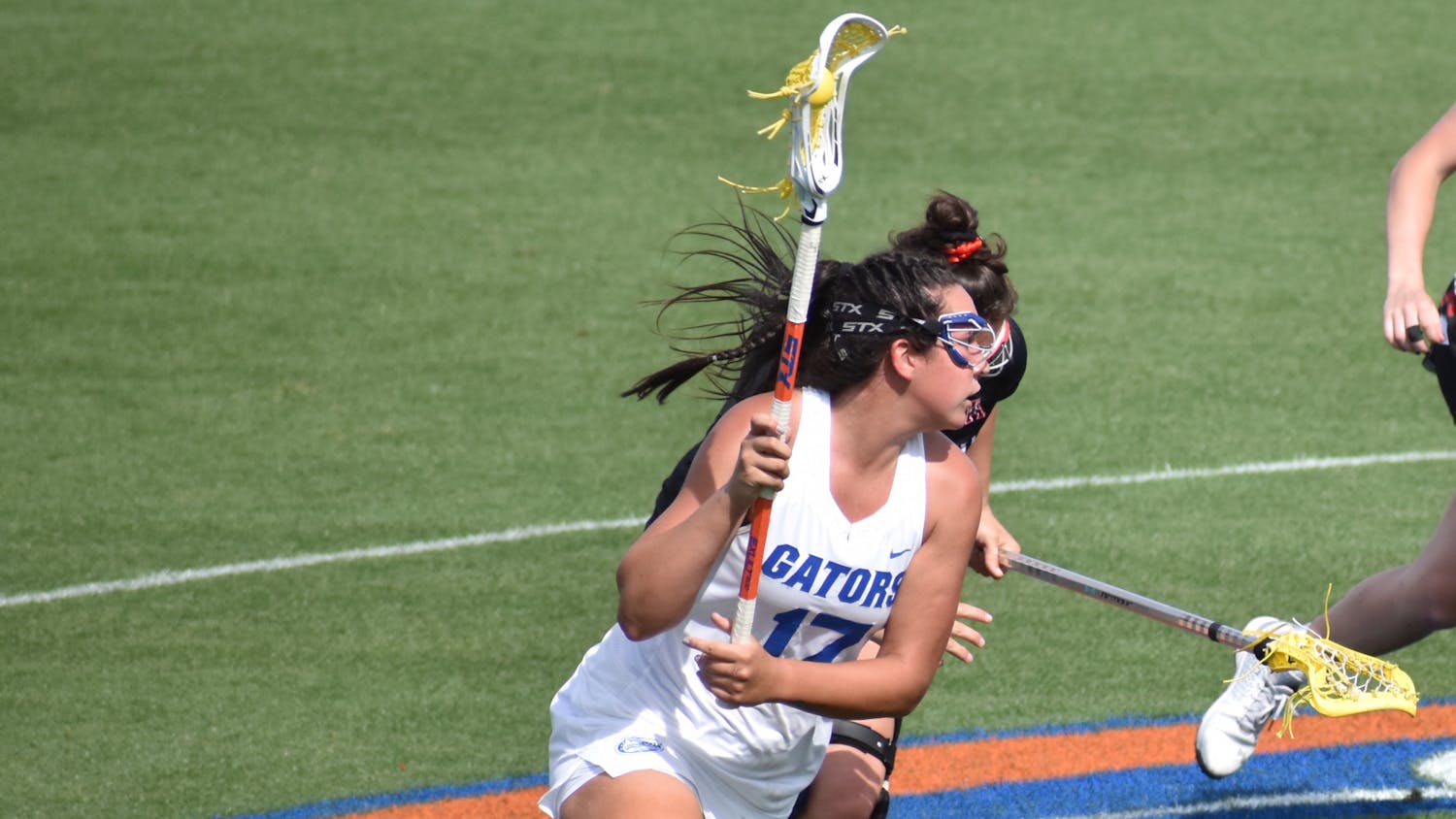 Florida&#x27;s Shannon Kavanagh (No.17, pictured) runs up the field with the ball against Cincinatti March 26. Kavanagh sits five goals short of 200 ahead of Florida&#x27;s regular season finale against Liberty Wednesday. 